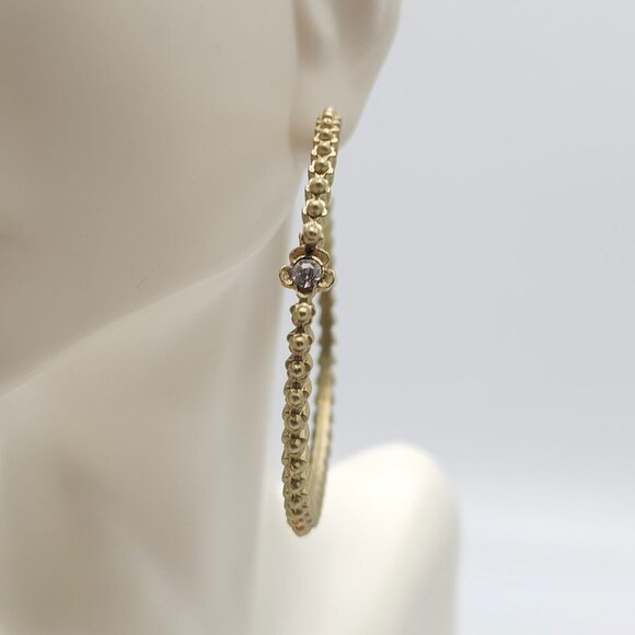 Gold Tone Textured Hoop Earrings With Rhinestone Flower Accents - Picture 2 of 7